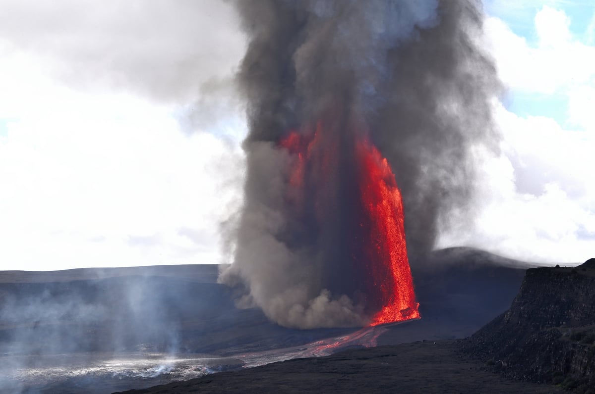 Dramatic volcanic eruption at Kilauea with lava against dark sky